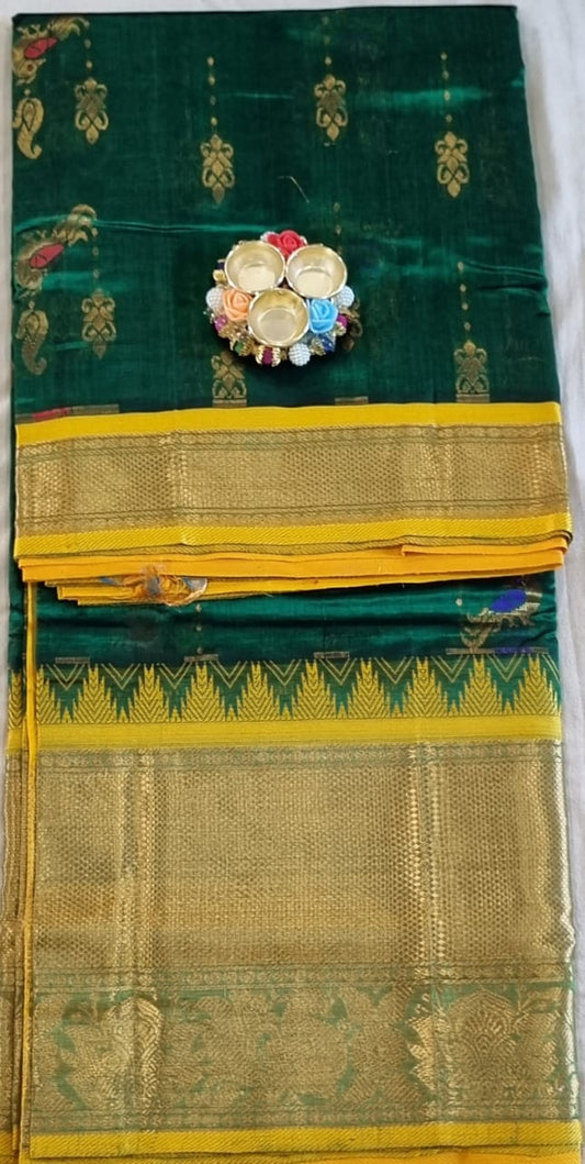 Green colour kuppadam pattu saree with golden zari buta and zari woven yellow border and rich pallu