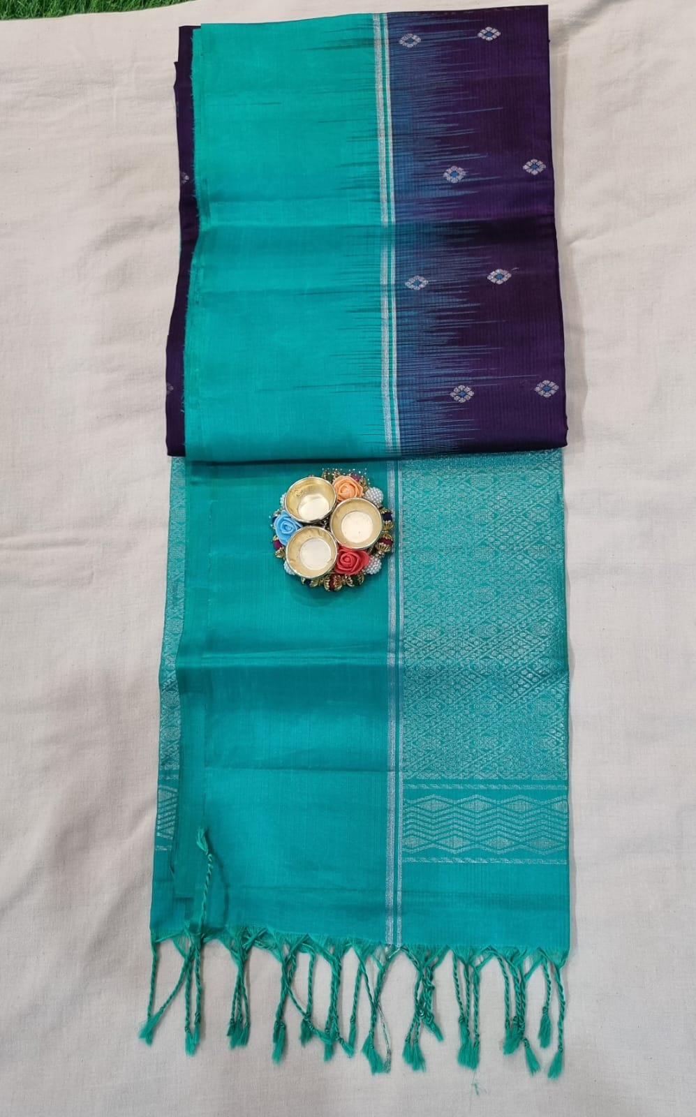 Soft silk dark purple(brinjal) colour saree with small zari buta and teal green simple border with heavy pallu